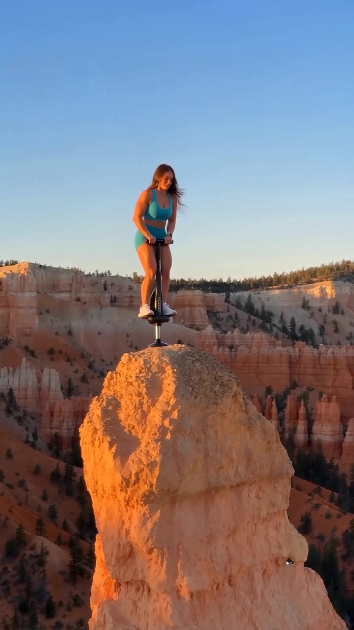 Brunette woman on a pogo stick
